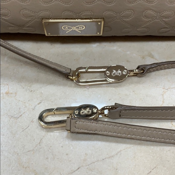 ANYA HINDMARCH LEATHER SIGNATURE EMBOSSED BOWS CROSSBODY BAG IN TAUPE - Picture 9 of 14